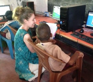 Pictures of Erin Experteering at computer with Vanavil Trust