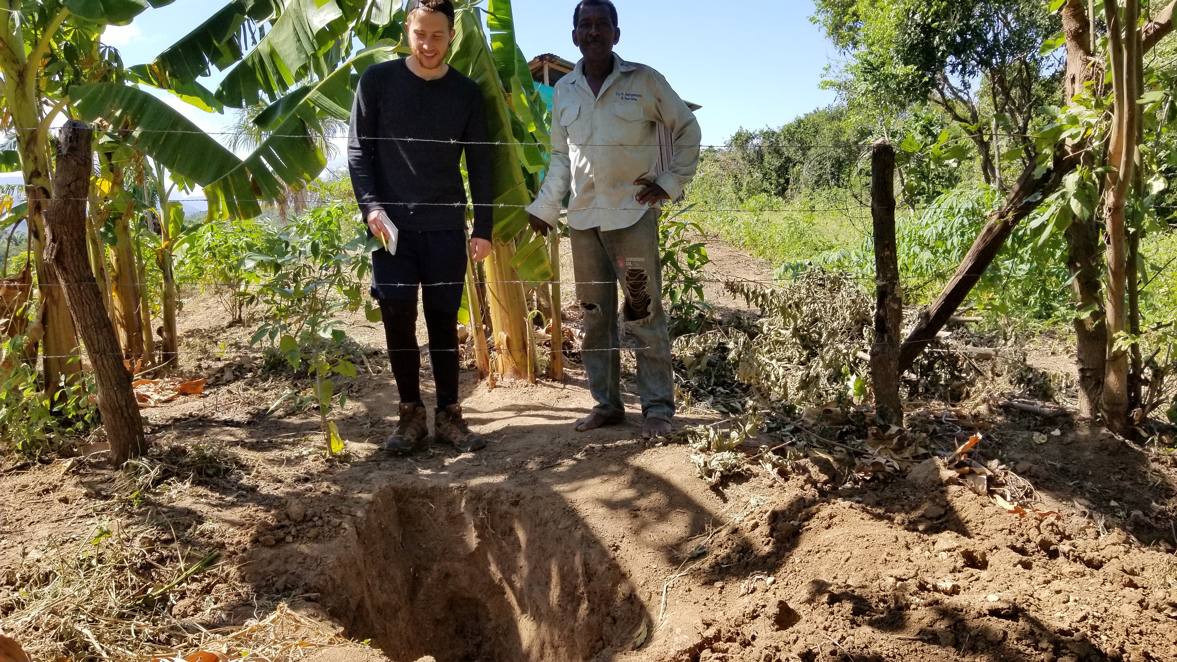 Zack in action with one of their irrigation projects.