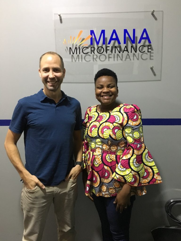 Darren working with Mana Microfinance Team