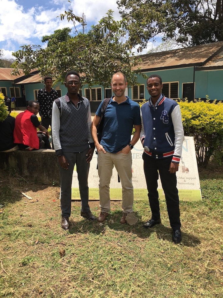 Volunteer Darren with social entrepreneurs outside Anza accelerator hub